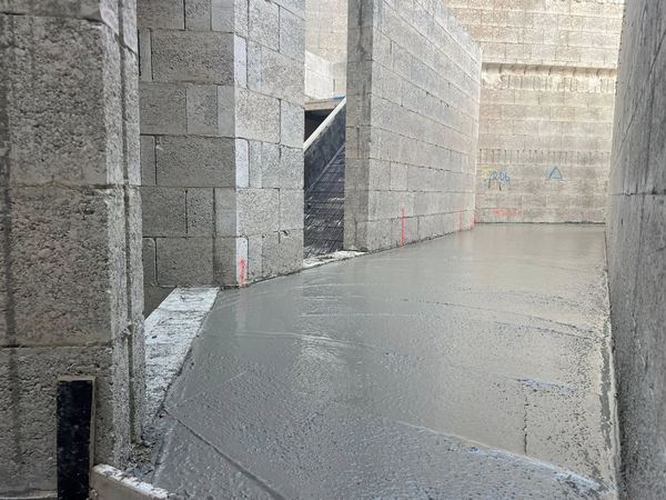 Freshly poured concrete floor slab, screeded level